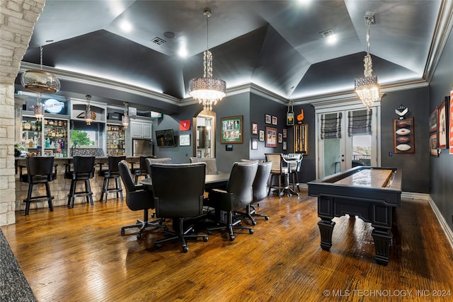 recreation room featuring crown molding, dark hardwood / wood-style flooring, and a chandelier