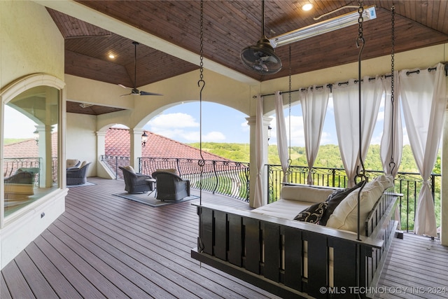 wooden terrace with outdoor lounge area and ceiling fan