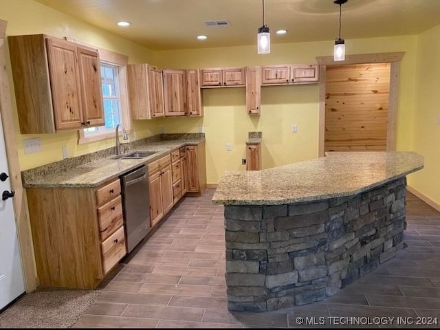 kitchen with light stone countertops, sink, a center island, stainless steel dishwasher, and pendant lighting