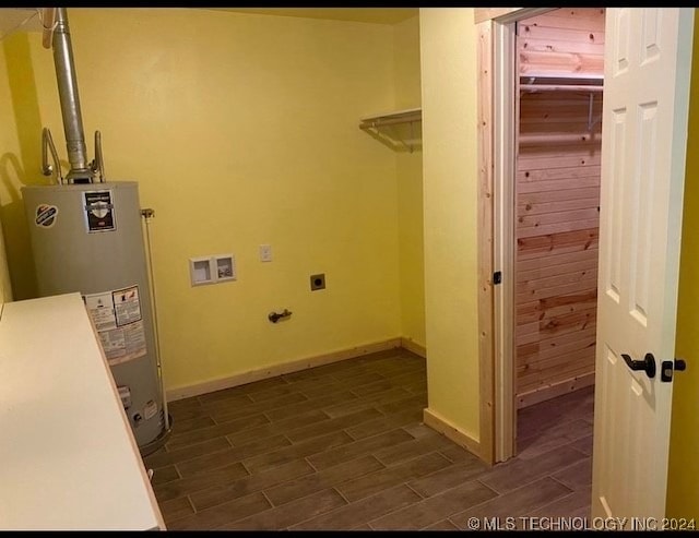 laundry area featuring hookup for an electric dryer, dark hardwood / wood-style flooring, hookup for a washing machine, and water heater