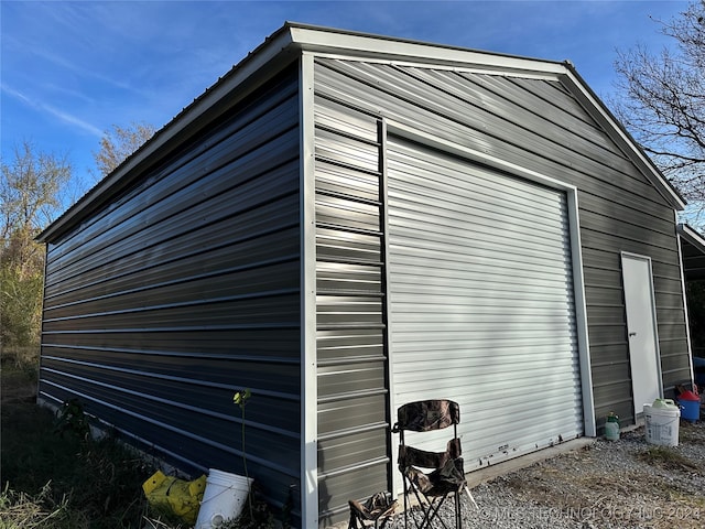 exterior space featuring an outbuilding and a garage