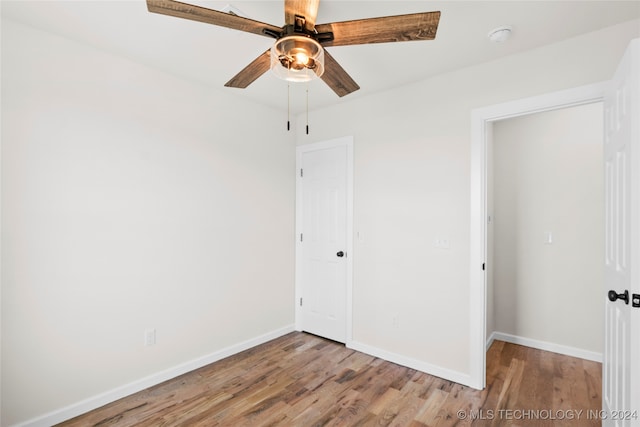 unfurnished bedroom featuring light hardwood / wood-style floors and ceiling fan