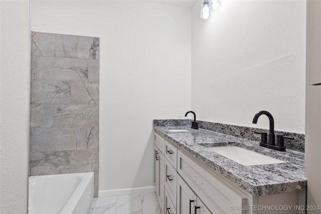 bathroom featuring vanity and a tub to relax in