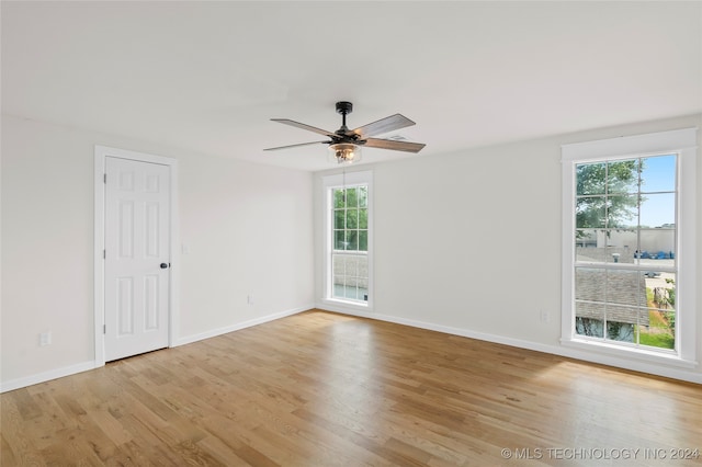 empty room with light hardwood / wood-style floors and ceiling fan