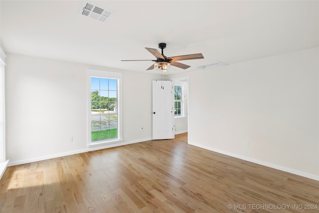 unfurnished room featuring ceiling fan and light wood-type flooring