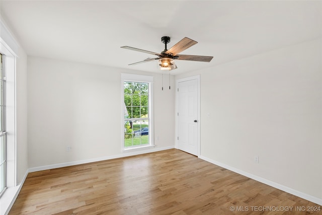 unfurnished room with ceiling fan and light hardwood / wood-style floors