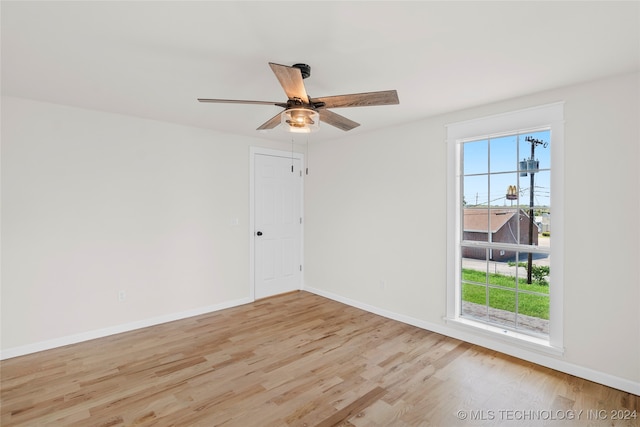 spare room with ceiling fan and light hardwood / wood-style flooring