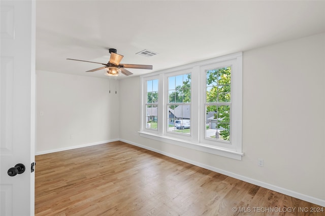 spare room featuring ceiling fan and light hardwood / wood-style flooring