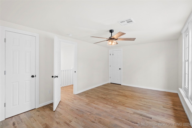 interior space featuring light hardwood / wood-style floors and ceiling fan