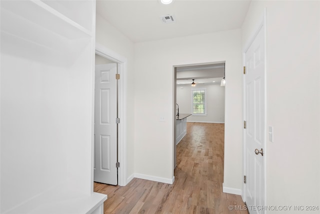 hallway featuring light hardwood / wood-style flooring