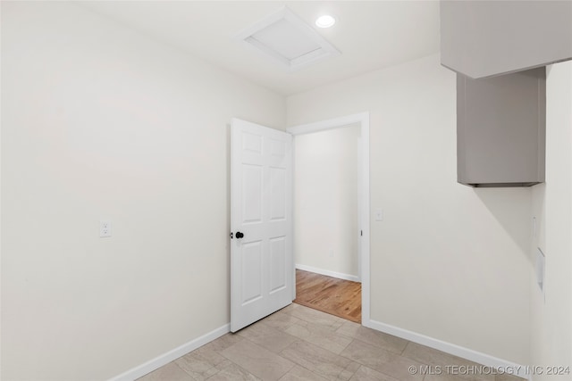 empty room with light hardwood / wood-style flooring