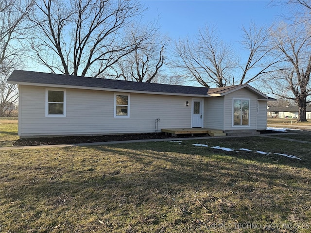 single story home featuring a front yard