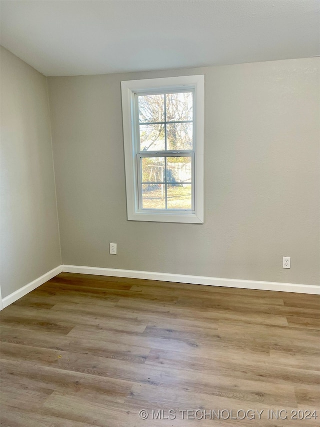 unfurnished room featuring light wood-type flooring