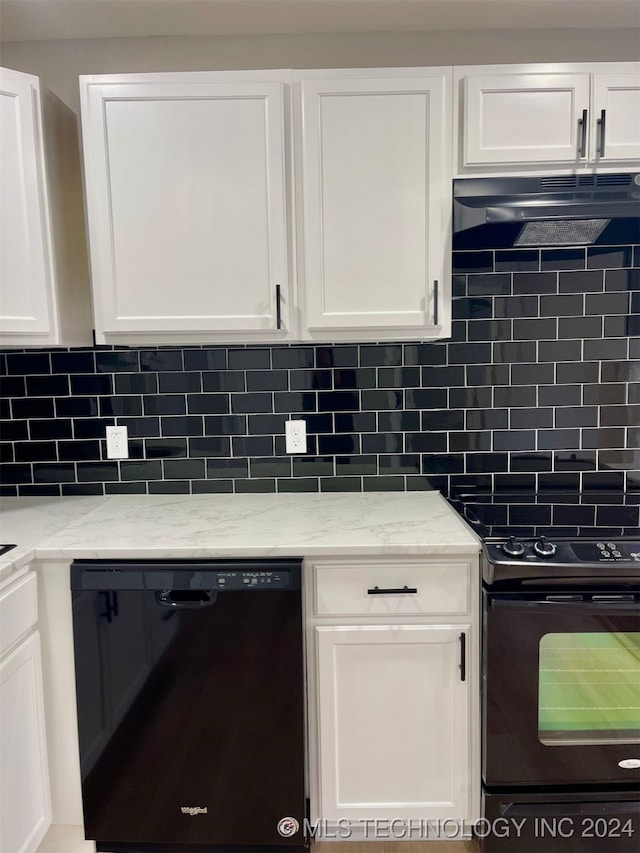 kitchen featuring white cabinetry, light stone countertops, decorative backsplash, and black appliances