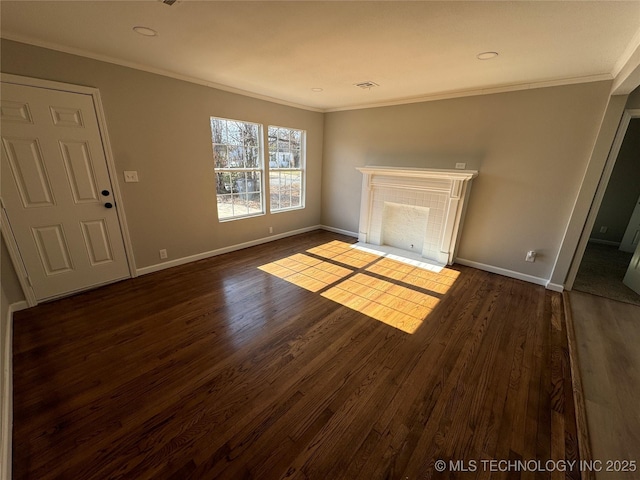 unfurnished living room featuring crown molding and dark hardwood / wood-style flooring