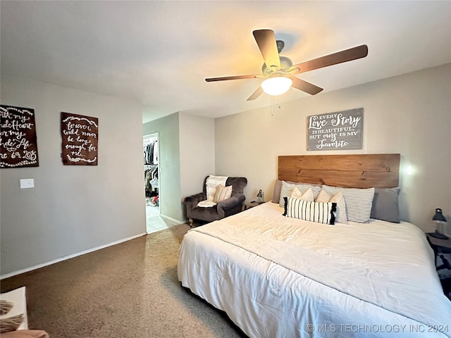 carpeted bedroom with ceiling fan and a closet