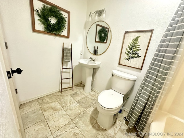 bathroom with sink and toilet