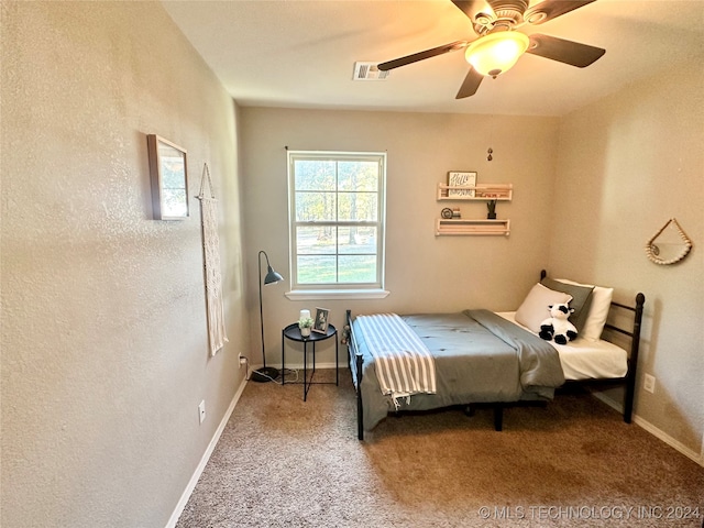 bedroom with ceiling fan and carpet floors