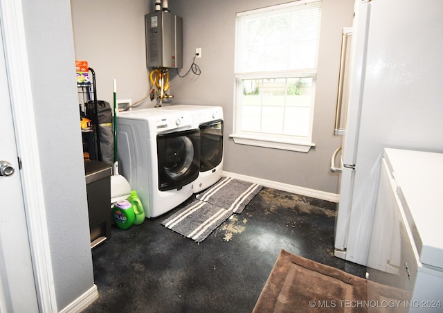 laundry area with washing machine and clothes dryer and tankless water heater