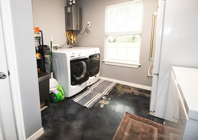 304 S Blackstone St, Vian, OK 74962 - washroom featuring water heater, separate washer and dryer, and baseboards