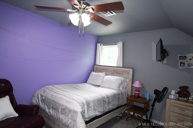 bedroom with carpet floors, vaulted ceiling, and ceiling fan