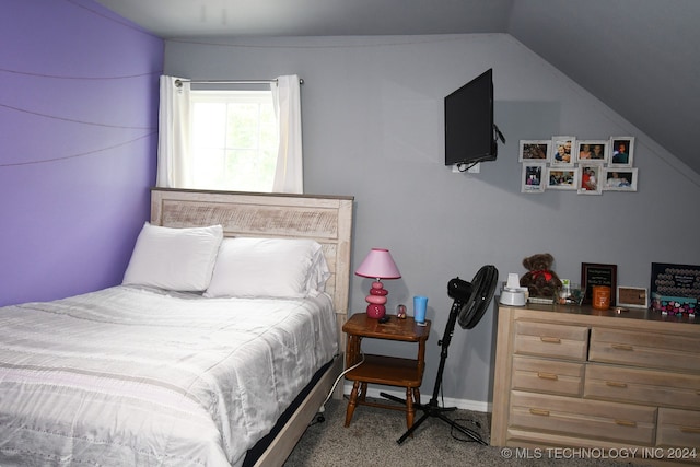 carpeted bedroom featuring vaulted ceiling