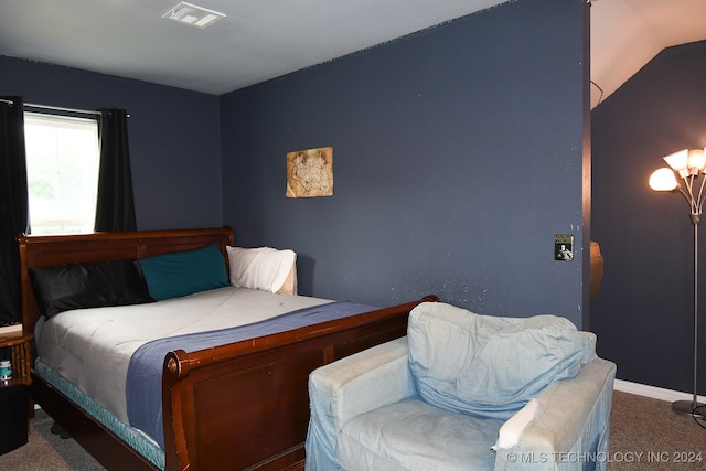 carpeted bedroom with vaulted ceiling