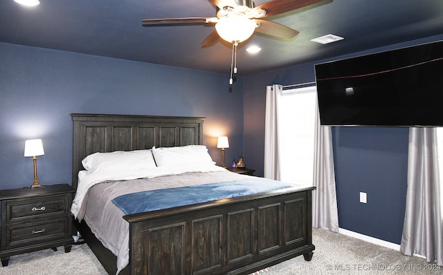 carpeted bedroom with ceiling fan