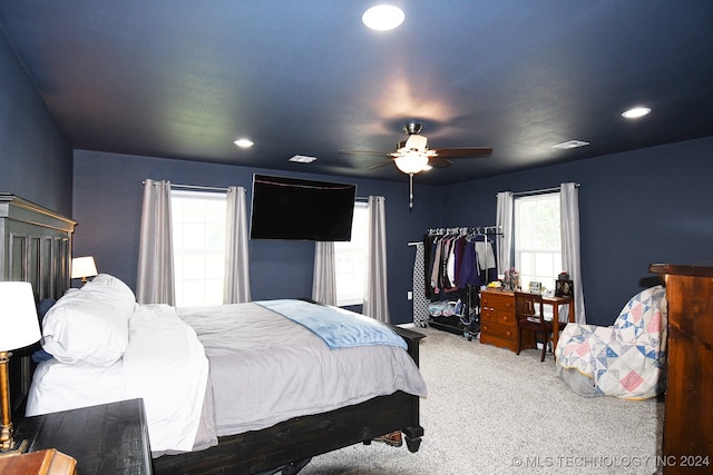 carpeted bedroom featuring ceiling fan