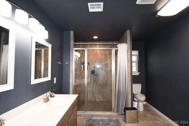 bathroom with toilet, vanity, tile patterned floors, and walk in shower