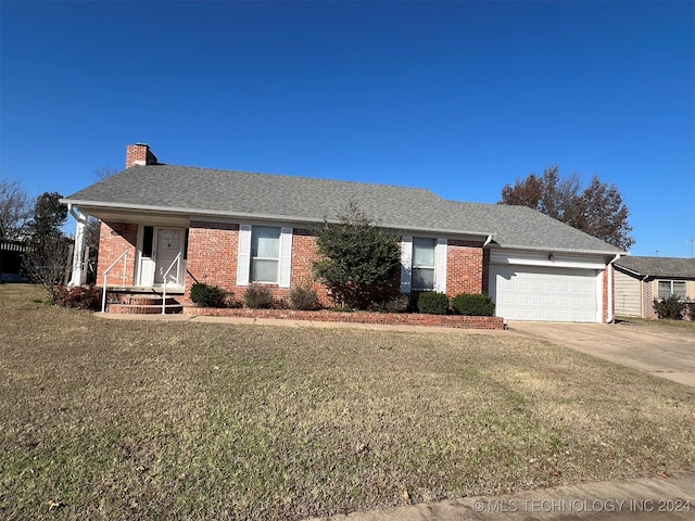 ranch-style home with a garage and a front lawn