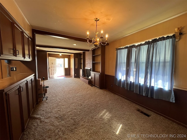 interior space with ornamental molding and a chandelier