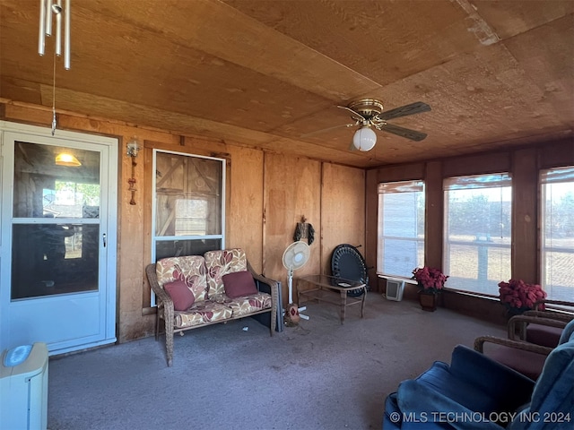 sunroom / solarium featuring ceiling fan