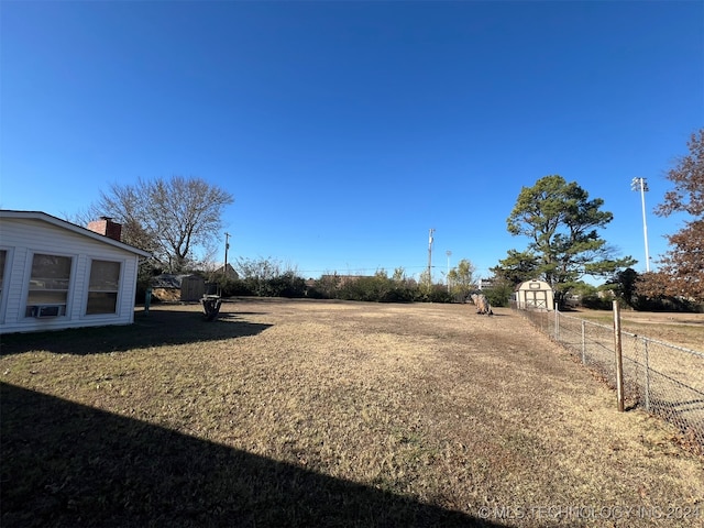 view of yard with a storage unit