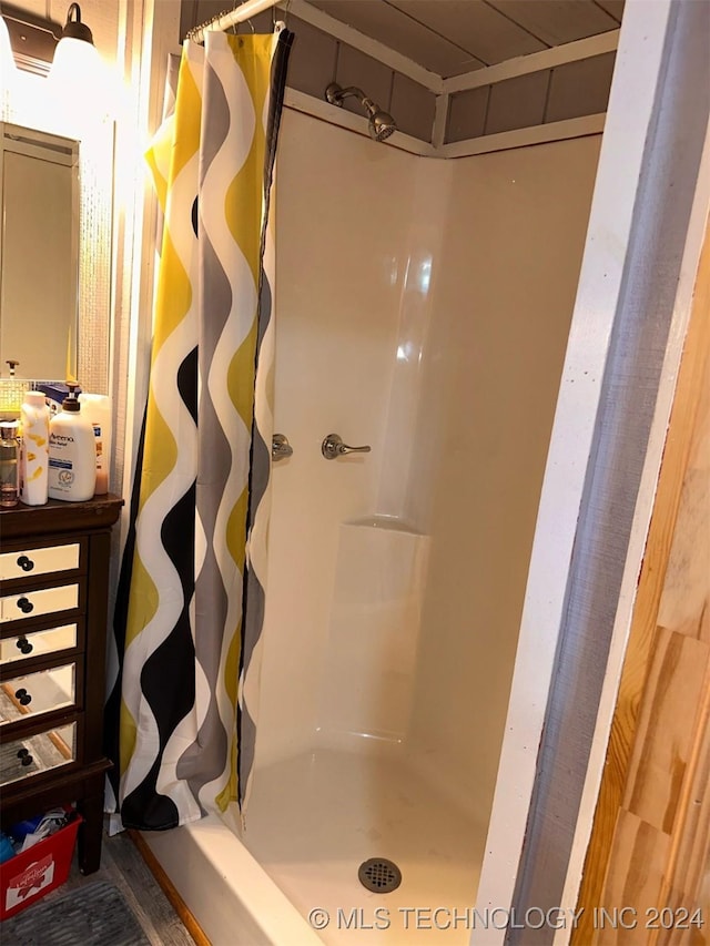 bathroom with a shower with shower curtain