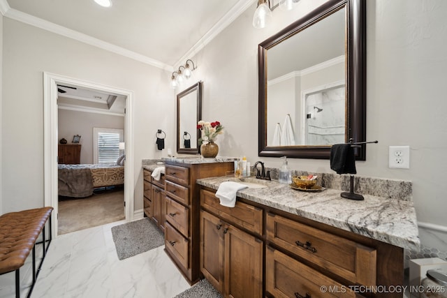 bathroom featuring crown molding and vanity