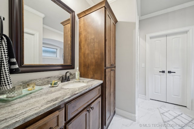 bathroom featuring ornamental molding and vanity