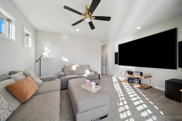 carpeted living room featuring ceiling fan