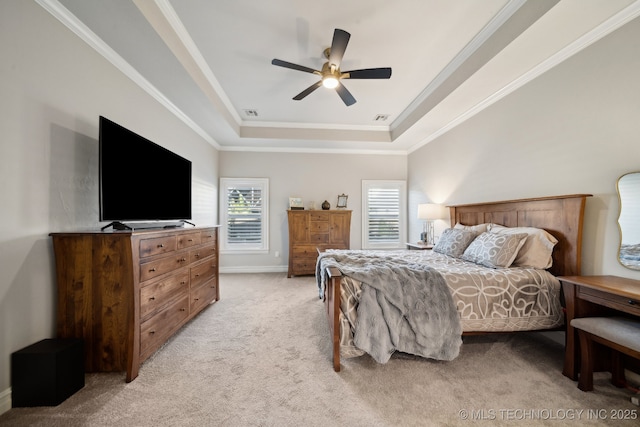 bedroom with a raised ceiling, light carpet, ceiling fan, and ornamental molding