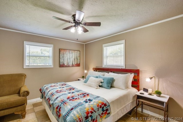 tiled bedroom with multiple windows, ceiling fan, and a textured ceiling