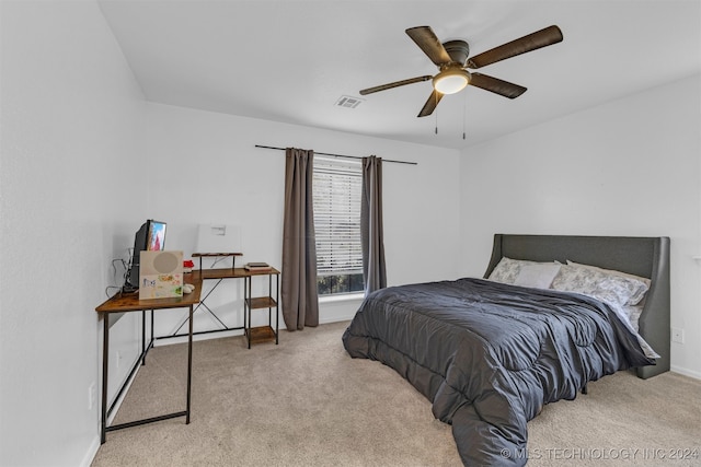 bedroom with ceiling fan and light colored carpet