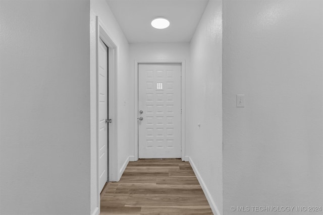 corridor featuring light hardwood / wood-style floors