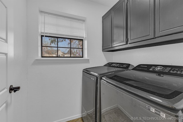 laundry area with cabinets and independent washer and dryer