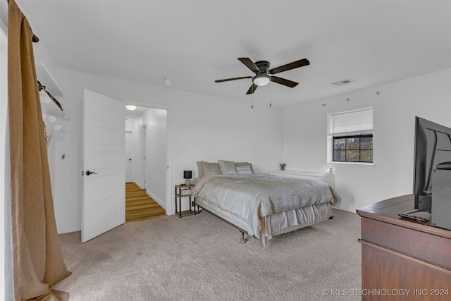 carpeted bedroom with ceiling fan