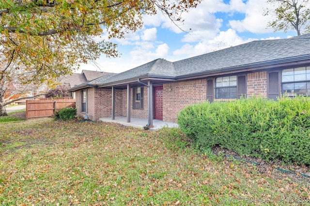 exterior space with a front lawn