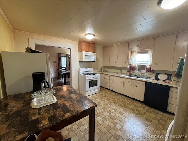 kitchen with white cabinetry, white appliances, sink, and cooling unit