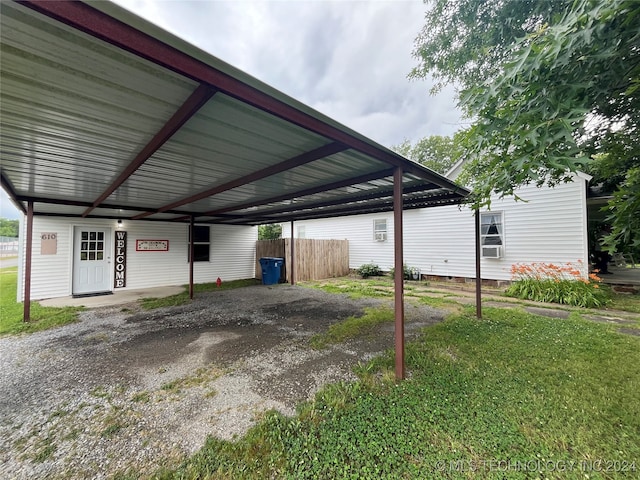 view of parking / parking lot with a yard and cooling unit