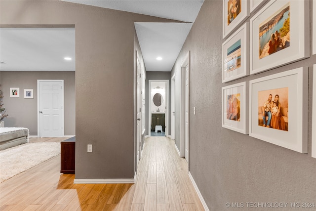 hallway with light wood-type flooring