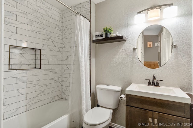 full bathroom with shower / tub combo, vanity, and toilet