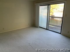 empty room with light colored carpet